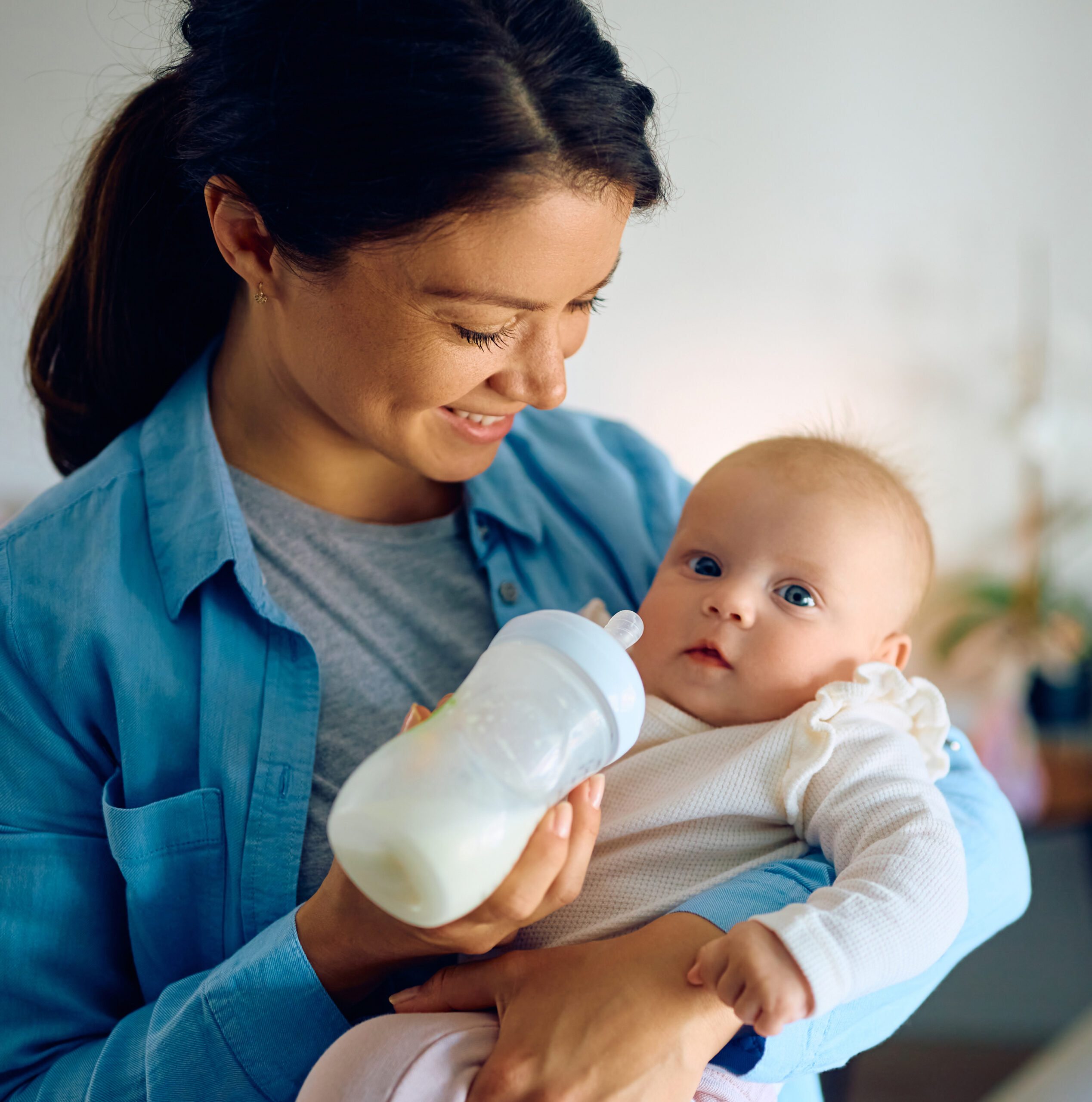 Happy mother feeding
